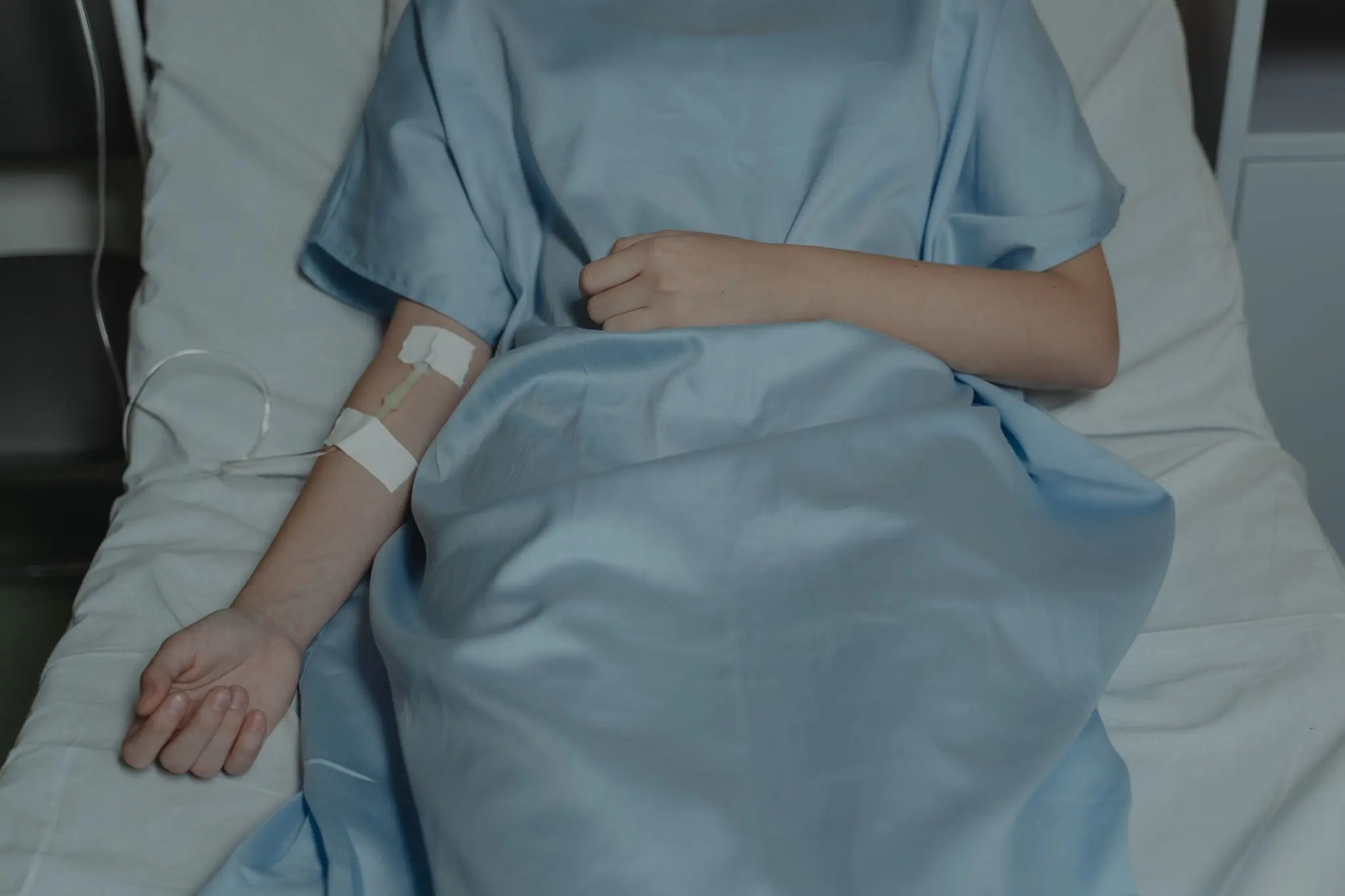 Hospital patient receiving intravenous treatment