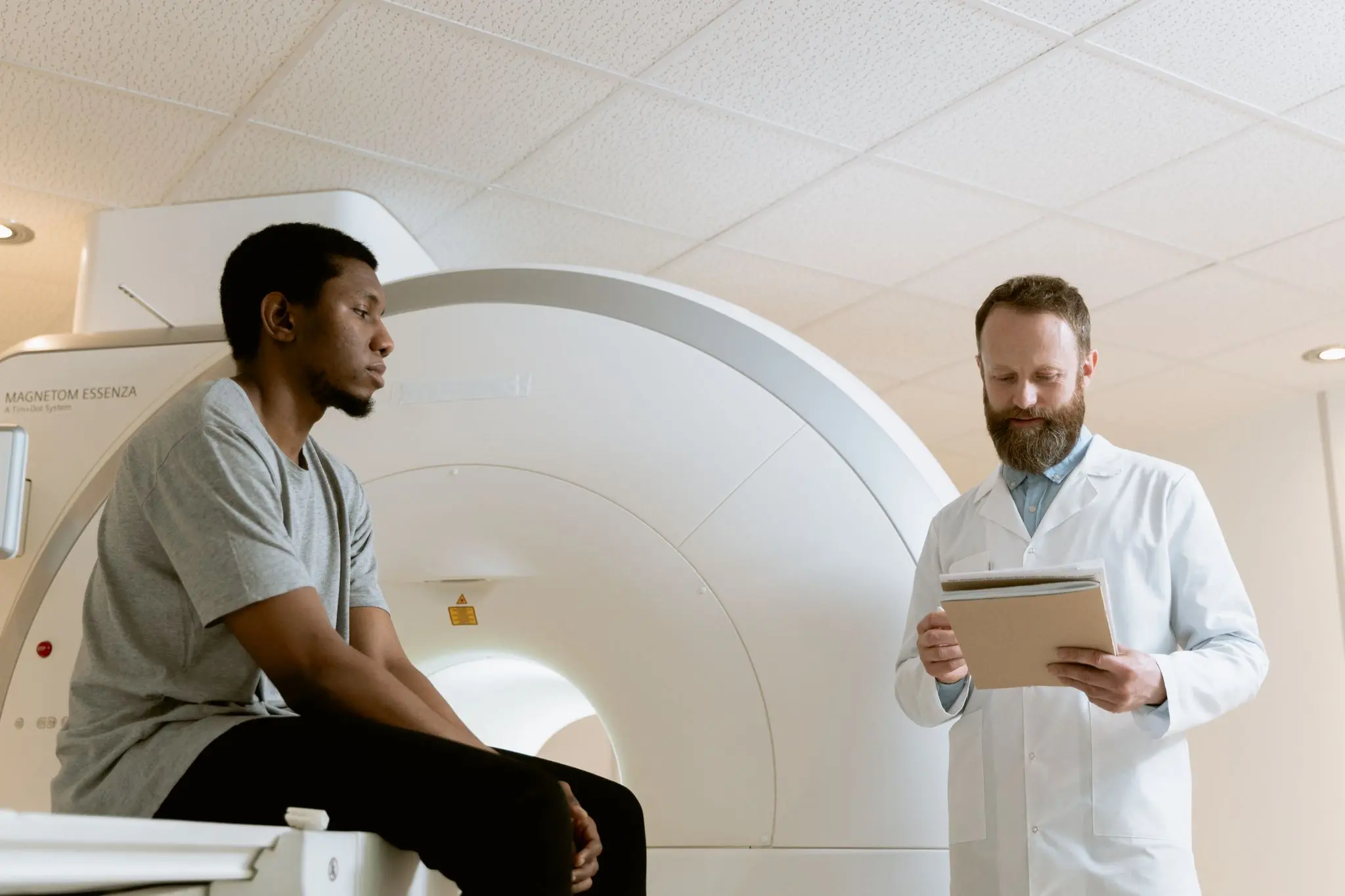 Doctor reviewing medical imaging with a patient